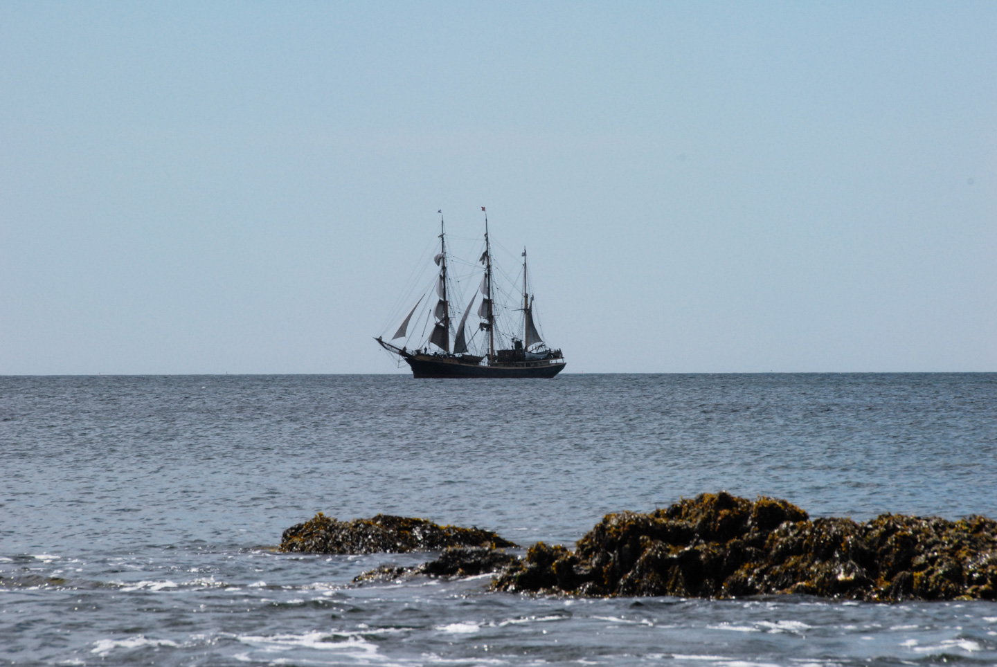 Tall ship with sails furled