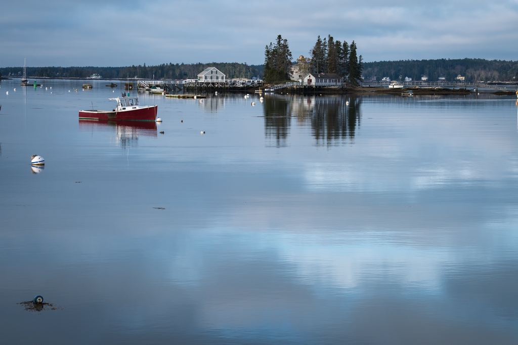 Boat & clouds reflected in Boothbay Harbor