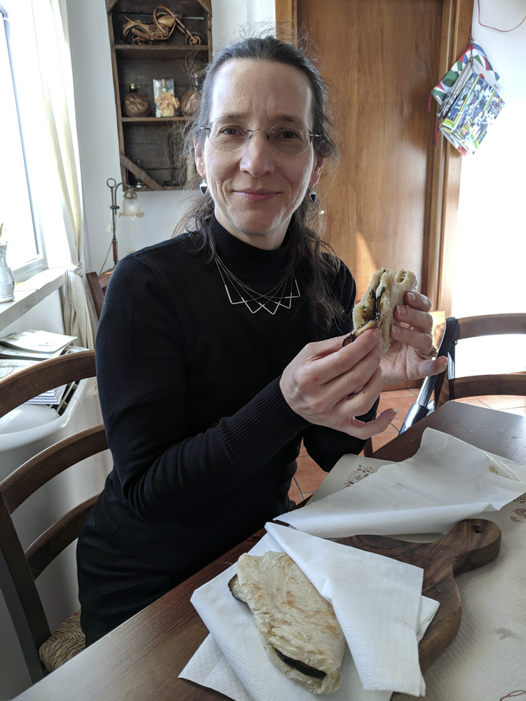 Anne eating a sandwich