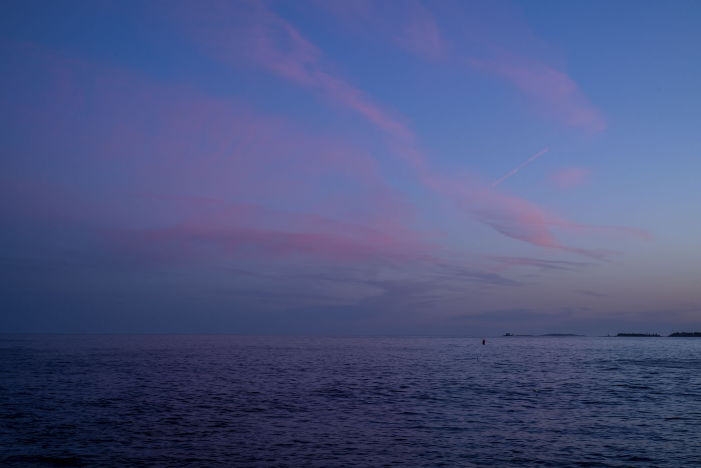 blue and pink colors in the sky before sunset