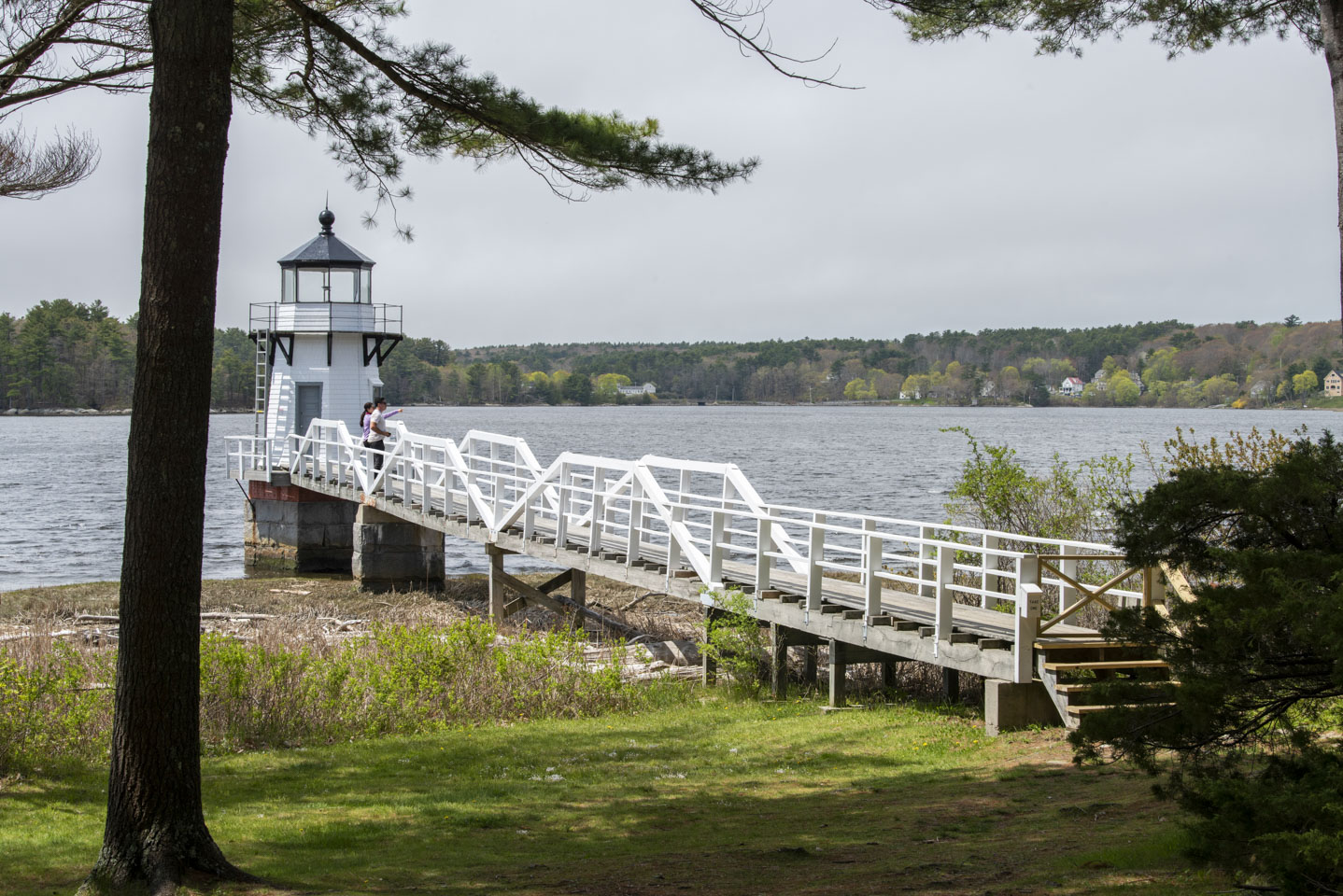 a couple standing on the walkway to Doubling Point Lighthouse
