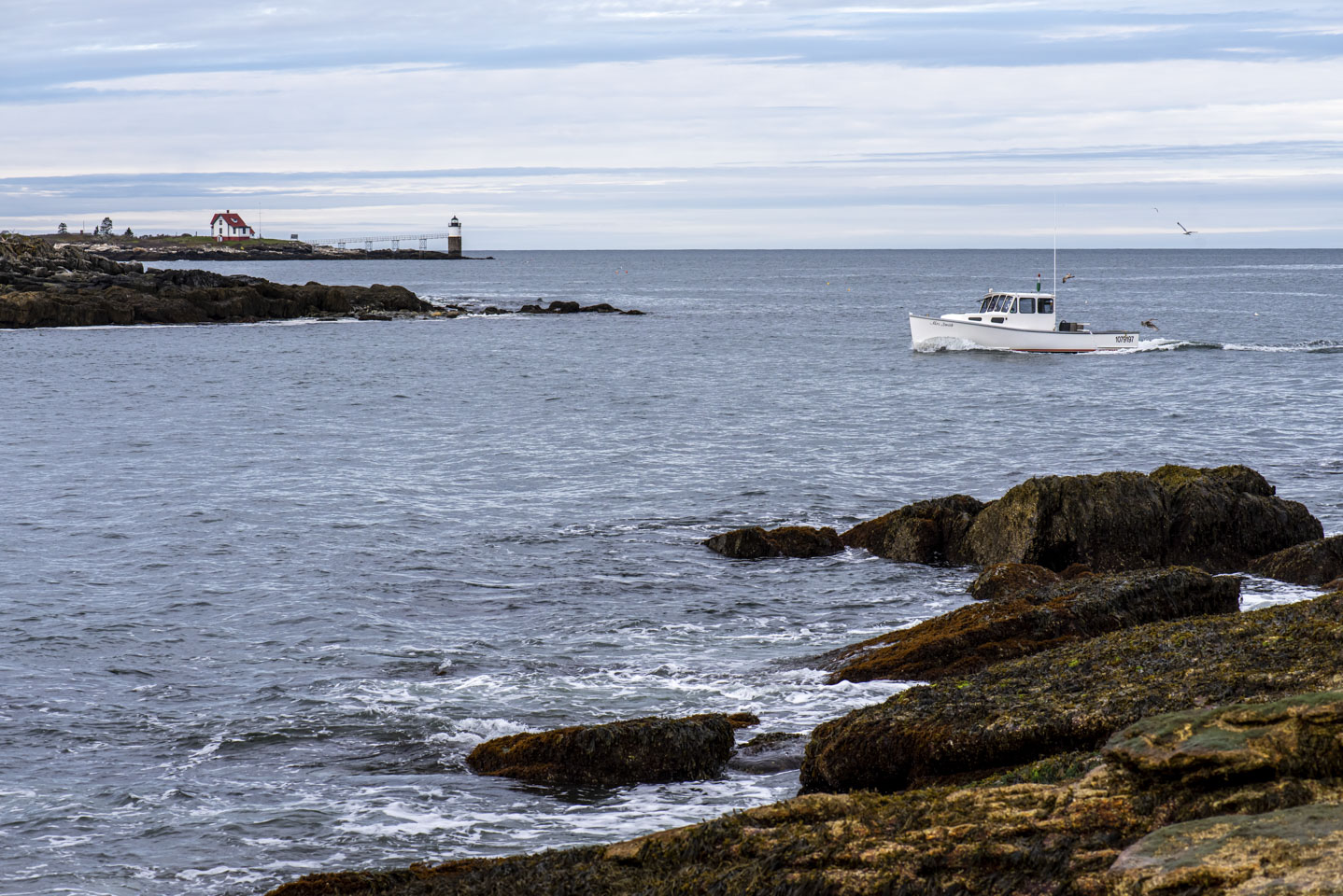 Ram Island Lighthouse and the lobster boat Mrs. Smith