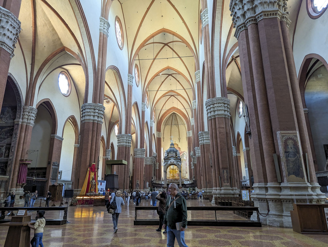 The interior of San Petronio, with Francesco walking across the floor.