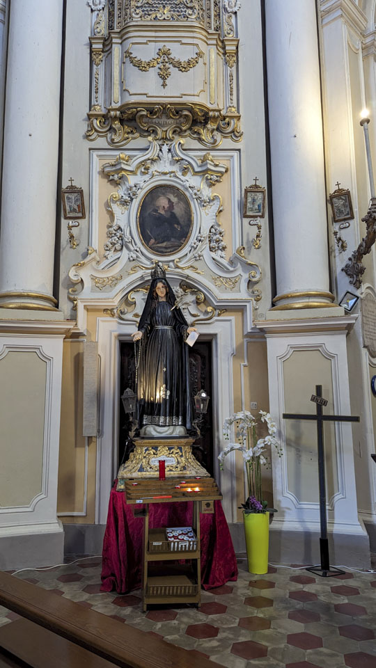 Statue of Saint Mary with a knife in her heart