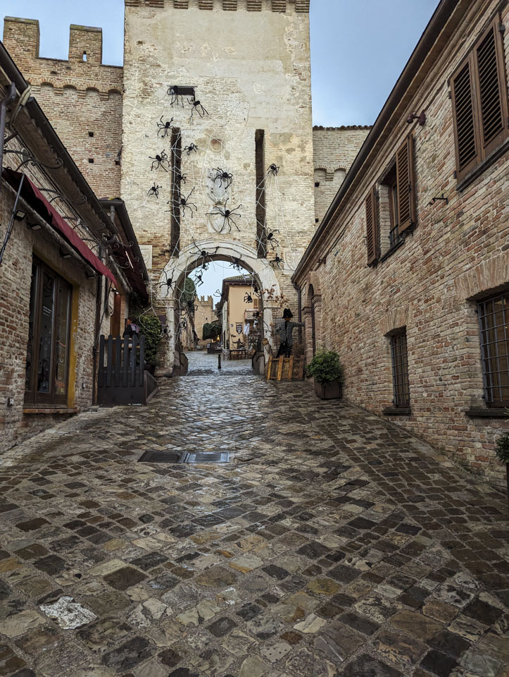 The main entrance into Gradara with artificial spiders climbing all over the wall