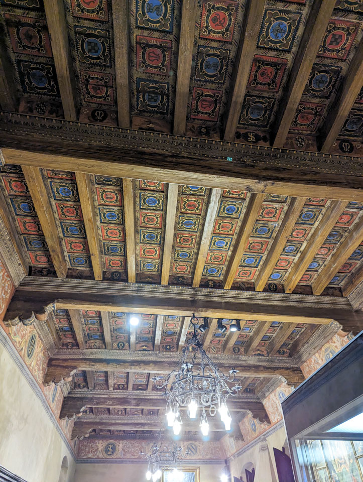 A painted ceiling in the Gradara castle, with red and blue squares painted as false coffered ceiling