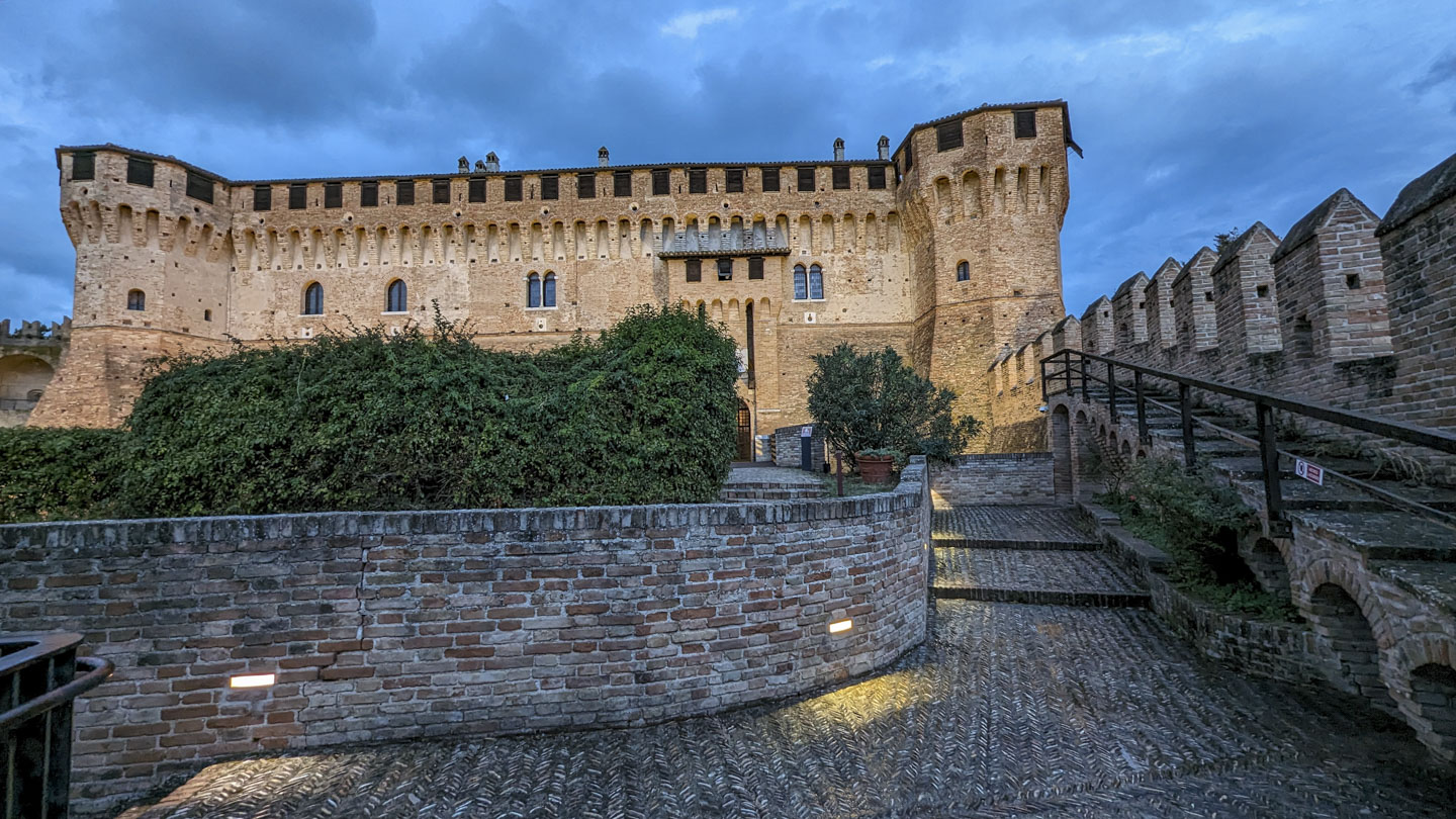 Gradara Castle in early evening, with clouds in the sky
