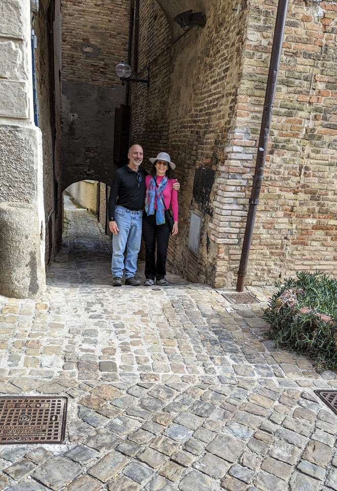 Paul and Anne standing in front of the side street