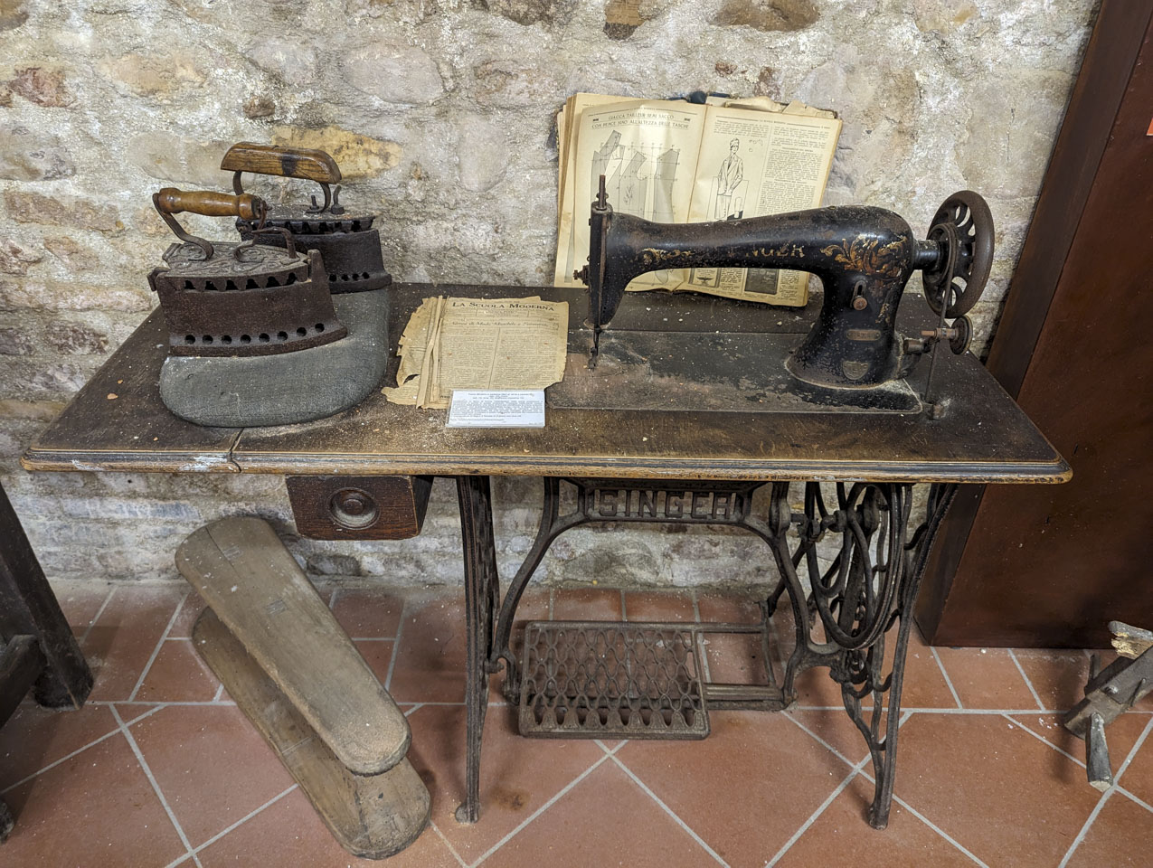 Antique sewing machine and accompanying items.