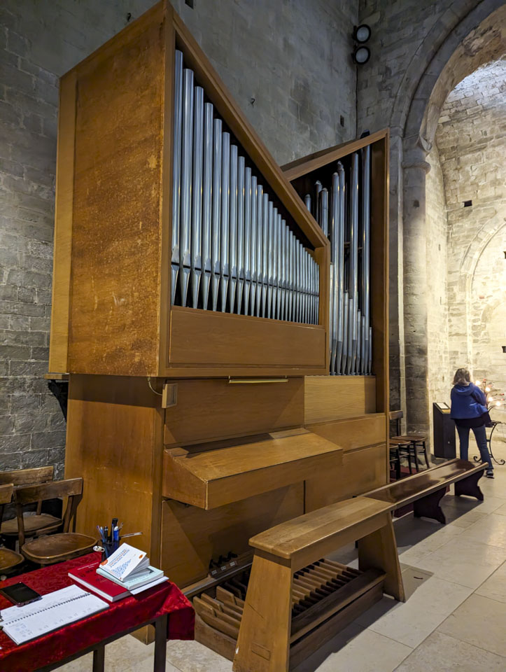An angular organ with light colored wood.