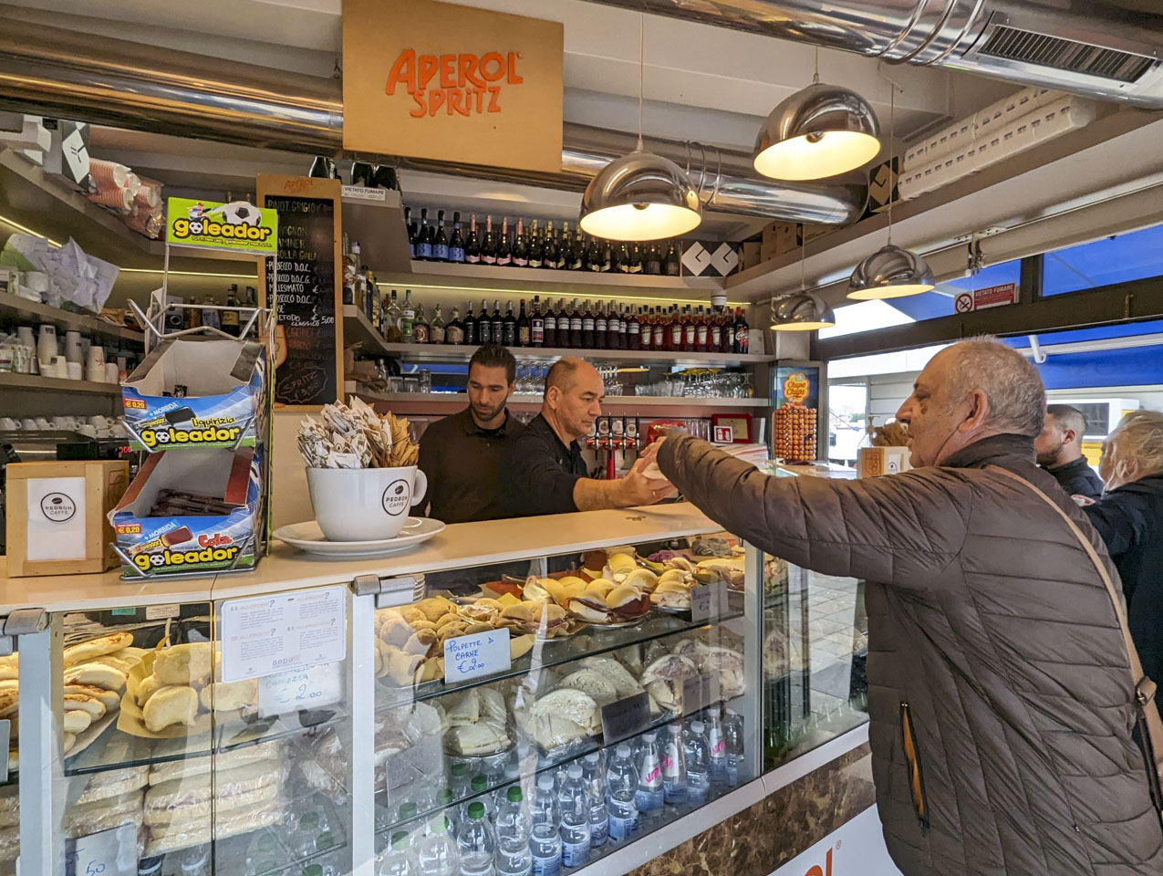 Francesco getting some food from a vendor