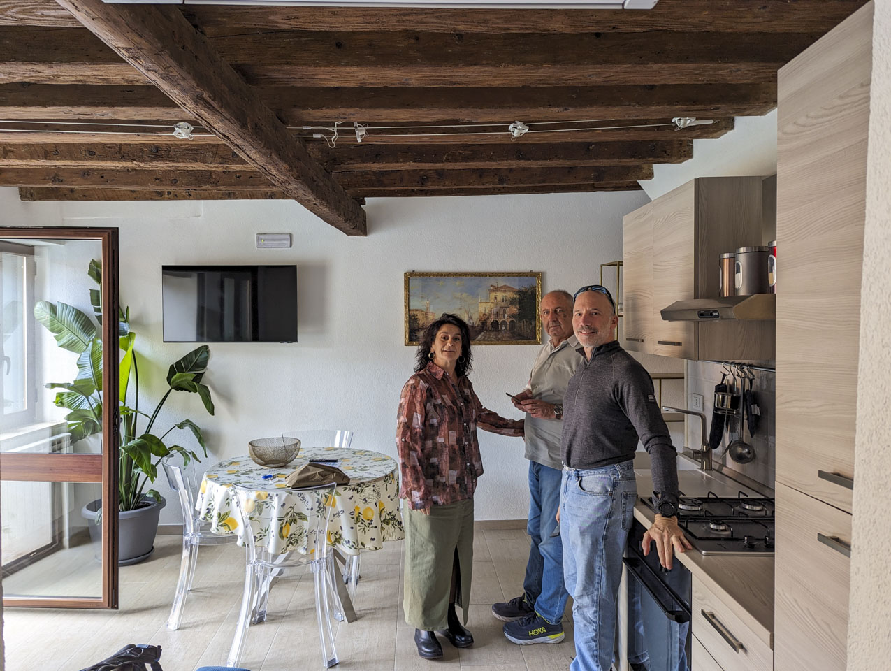 Doni, Francesco, and Paul in the living area of the rental.