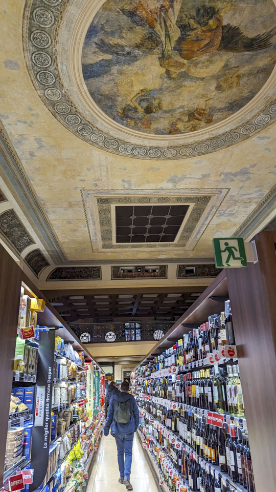 An aisle of the grocery store that is in the old Teatro Italian building