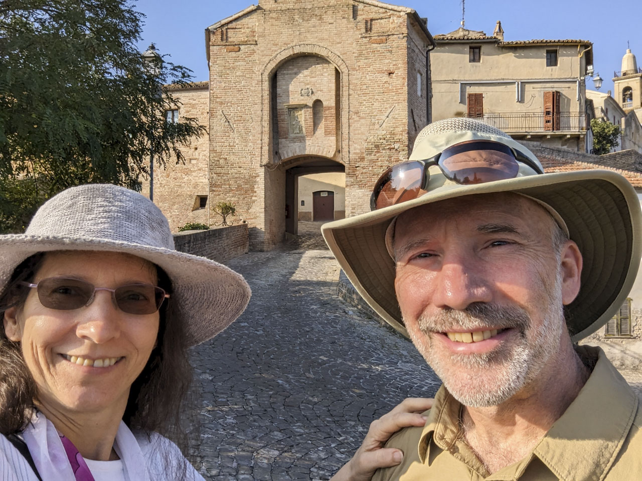 Anne and Paul in front of the entrance to Sant'Andrea di Suasa