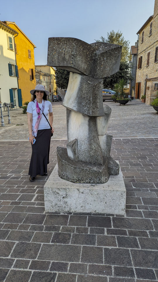 Anne standing next to a statue