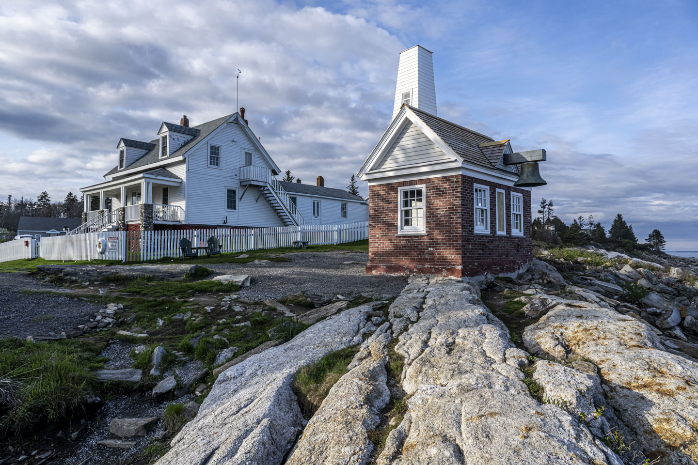 Looking past the fog house to the lighthouse.