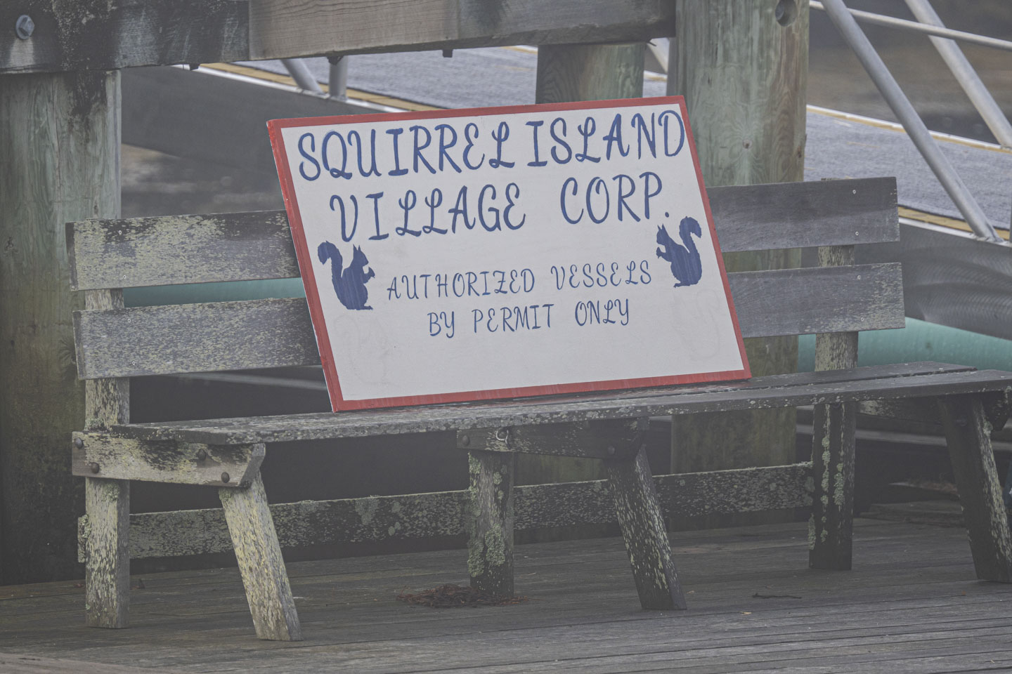 A sign says Squirrel Island Village Corp Authorized Vessels by Permit Only.