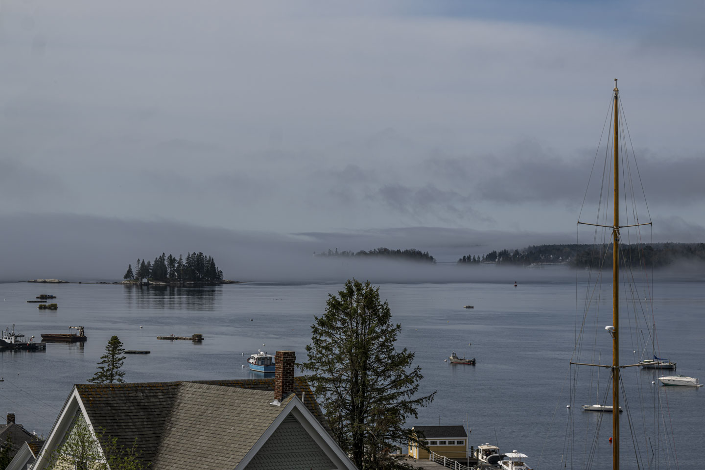 Bands of fog can be seen around islands in the distance, but the rest of the scene is clear.