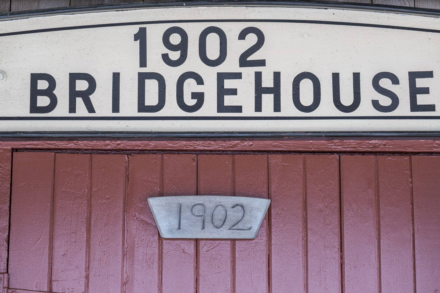 A sign says 1902 Bridgehouse