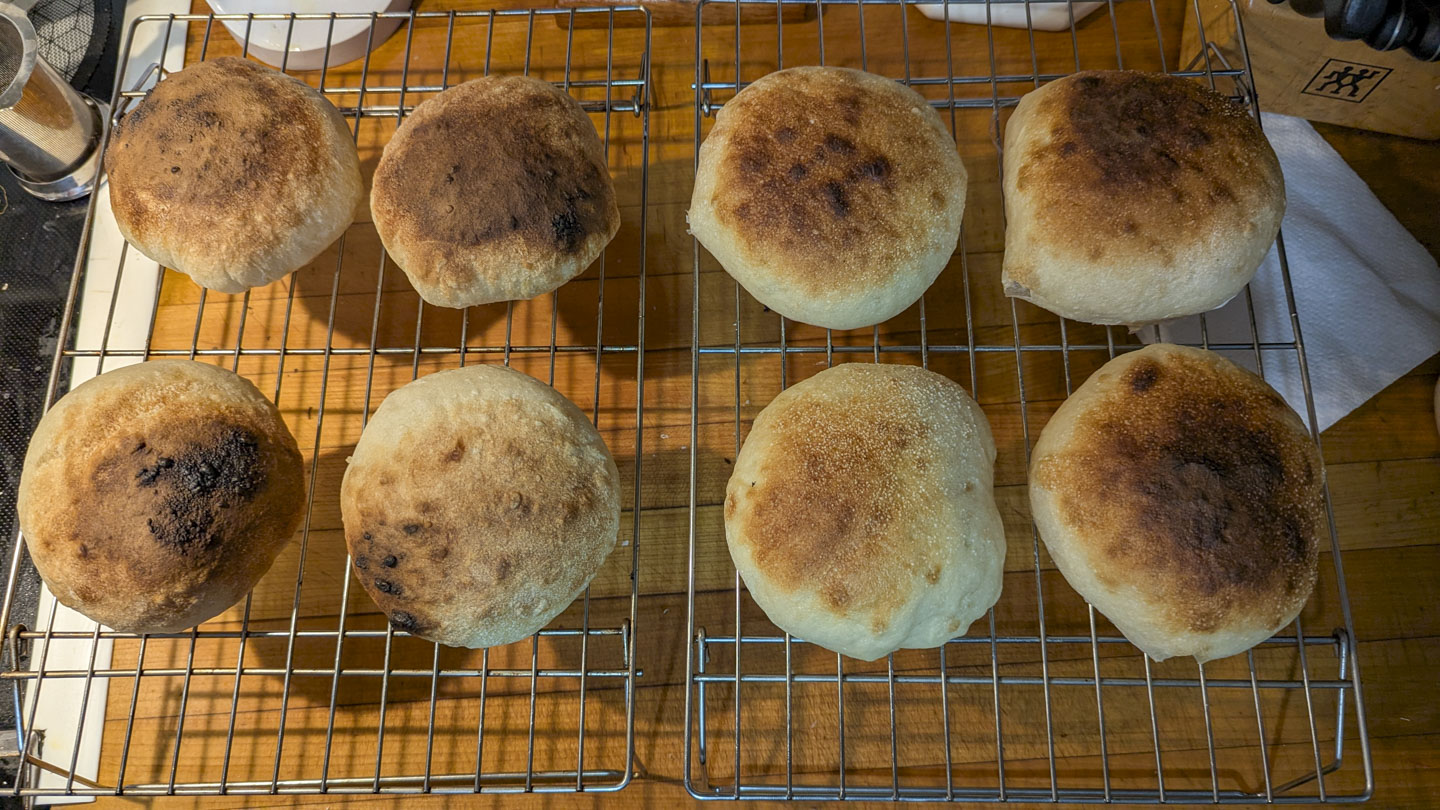 Eight round rolls on a cooling rack
