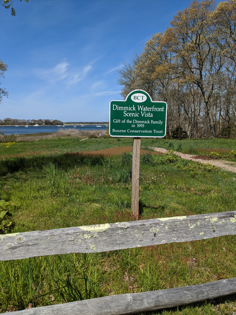 Sign for Dimmick Vista and a view out to the water