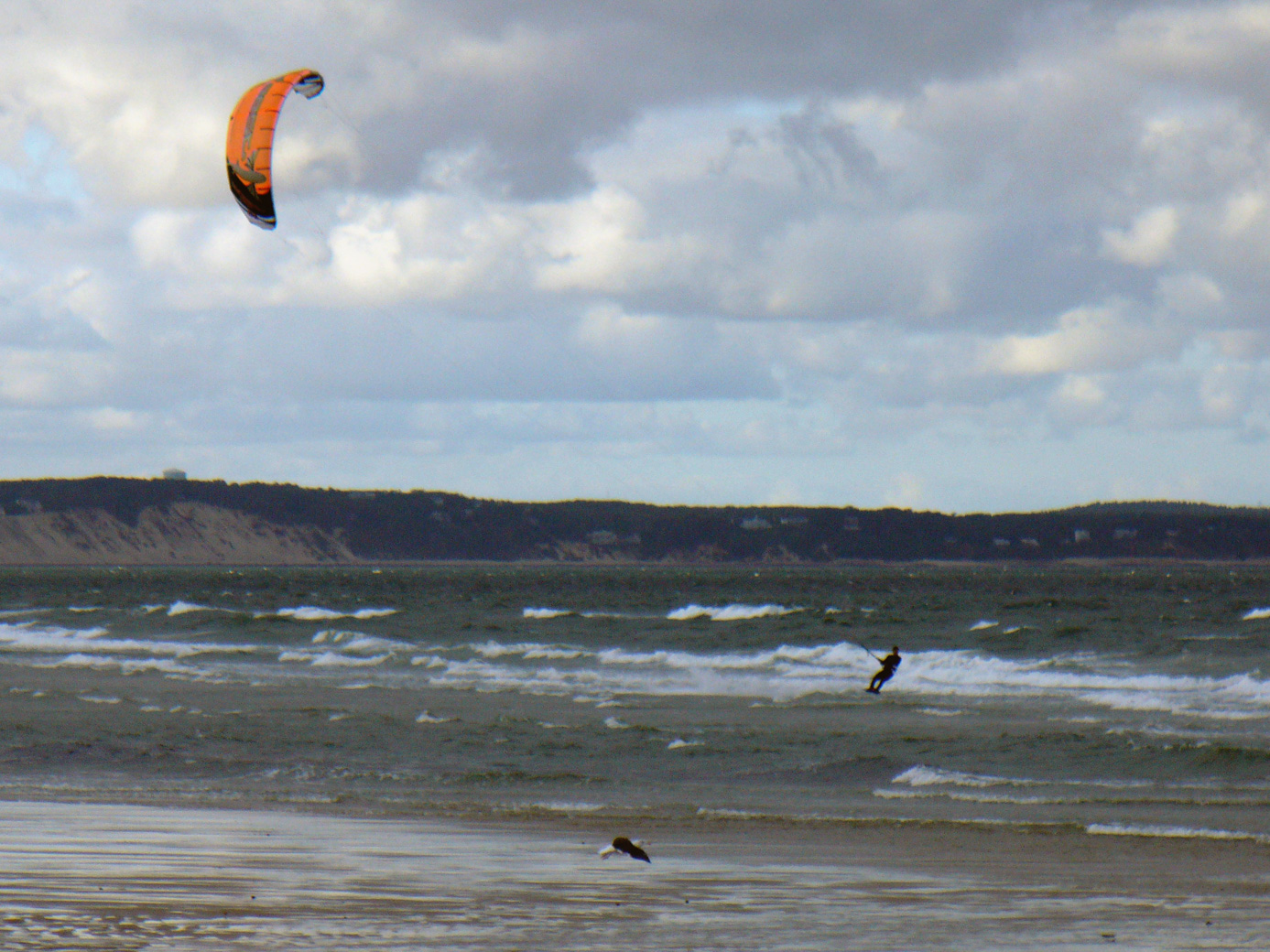 windsurfer with Plymouth MA White Cliffs in the distance
